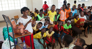 At an AMREF-organized alternative rites of passage workshop in Magadi, Kenya, 2013, Masai girls learn about sexual and reproductive rights and self-confidence. (Anja Legtenberg)